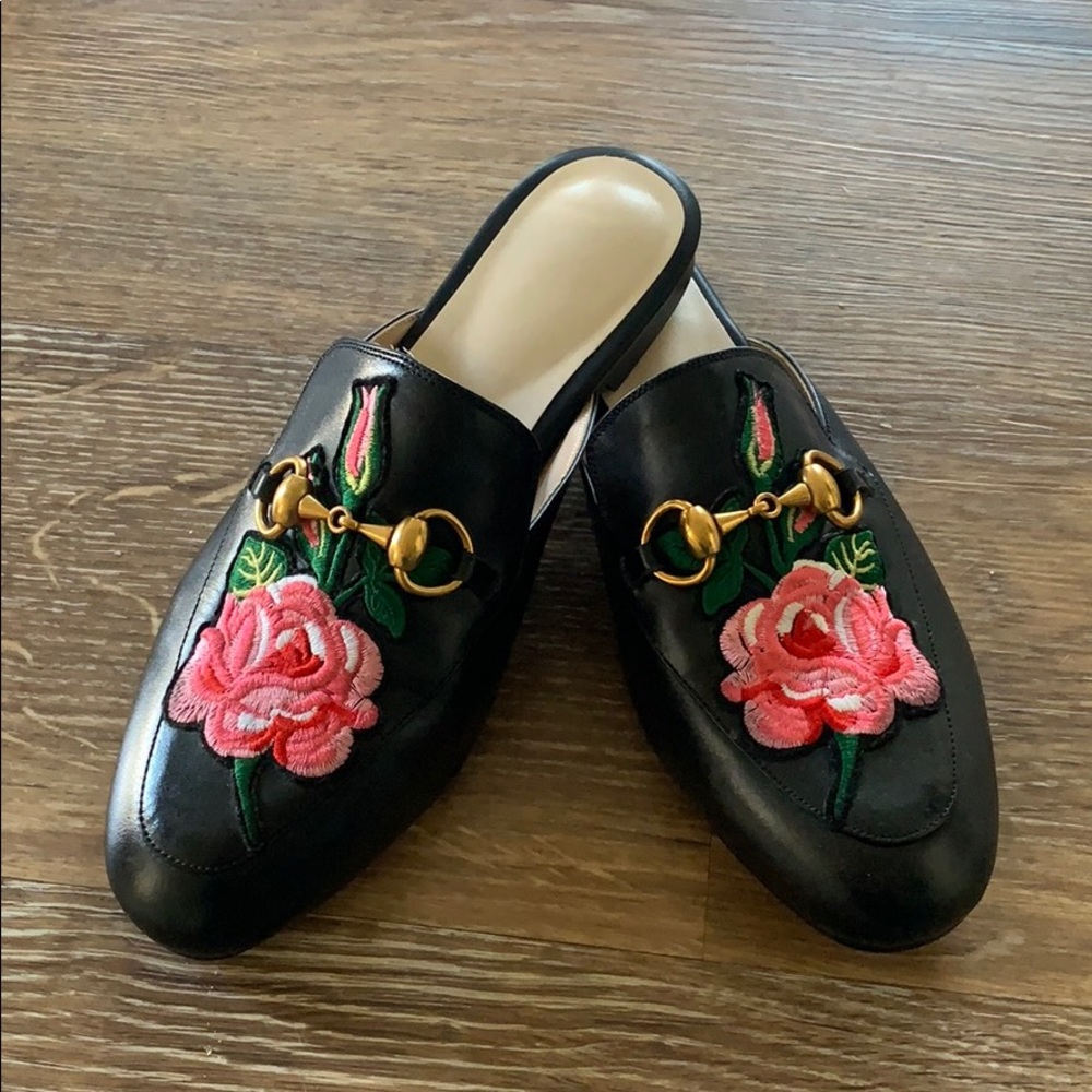 Loafers with pink flower embellishment